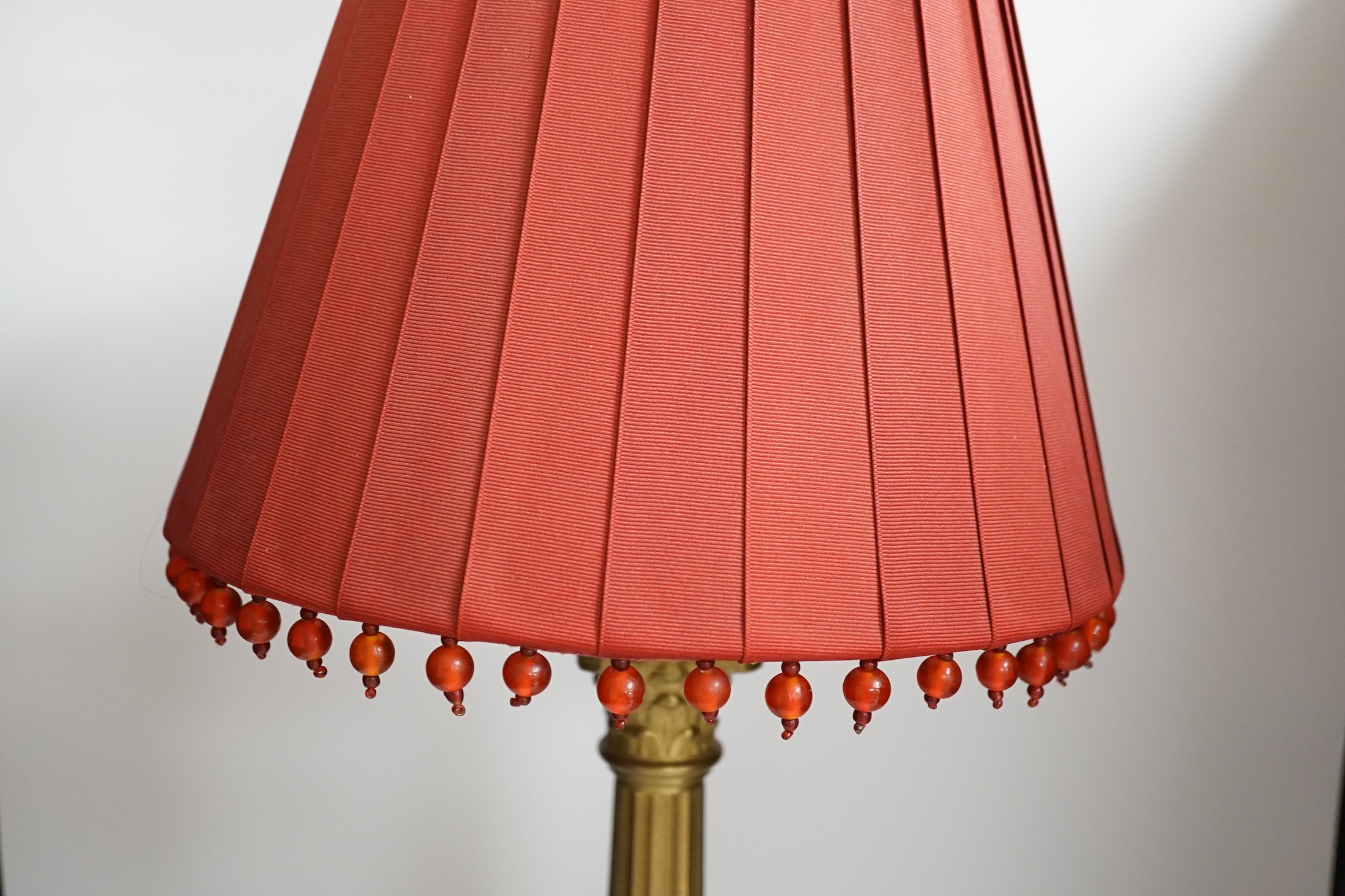 A brass column table lamp, 65cm high